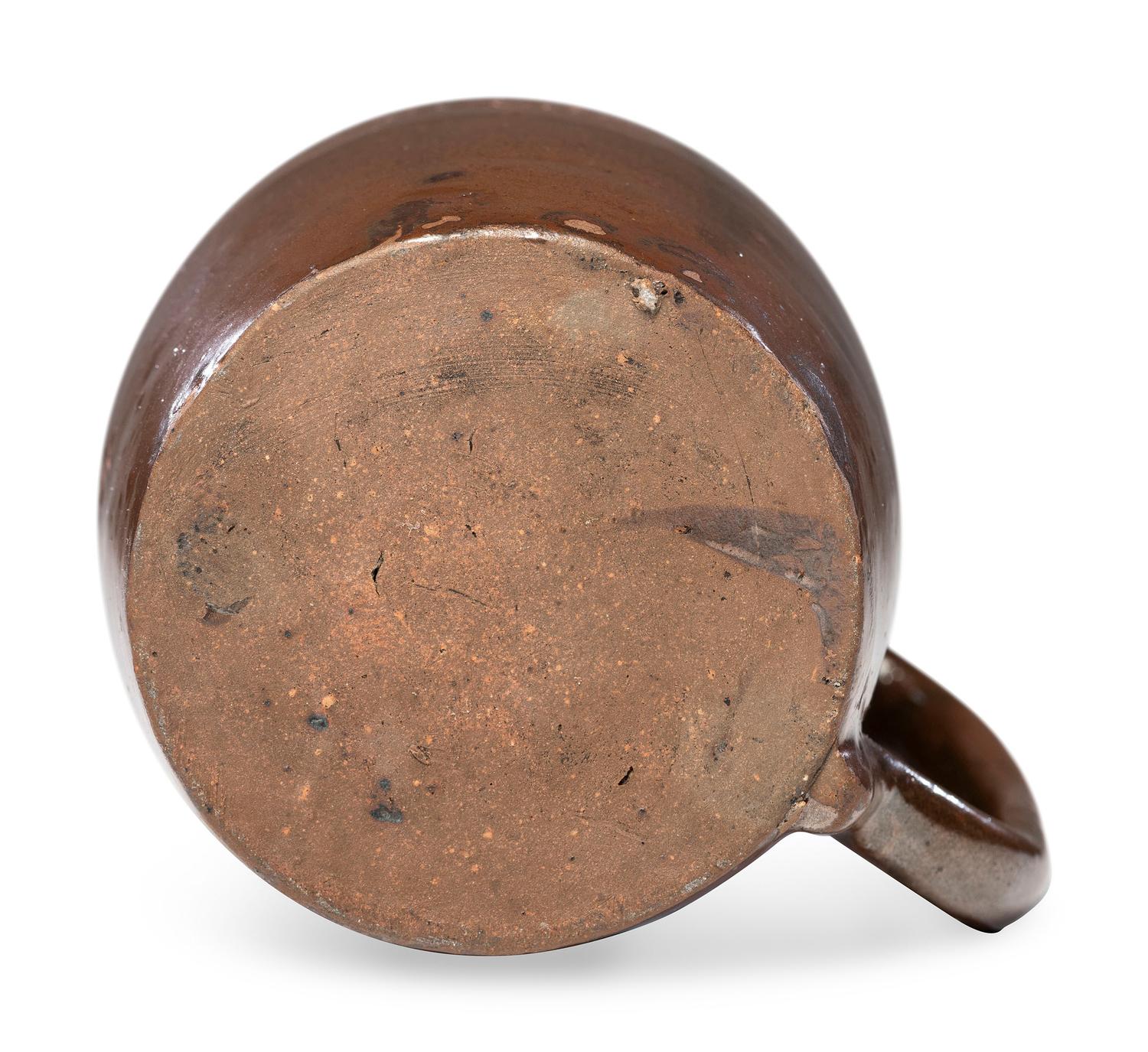 A Heavily Incised Albany Slip-Glazed Stoneware Beer Mug