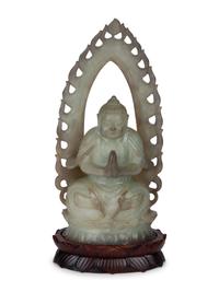 A Chinese Carved White Jade Seated Buddha Under Halo — 20TH CENTURY