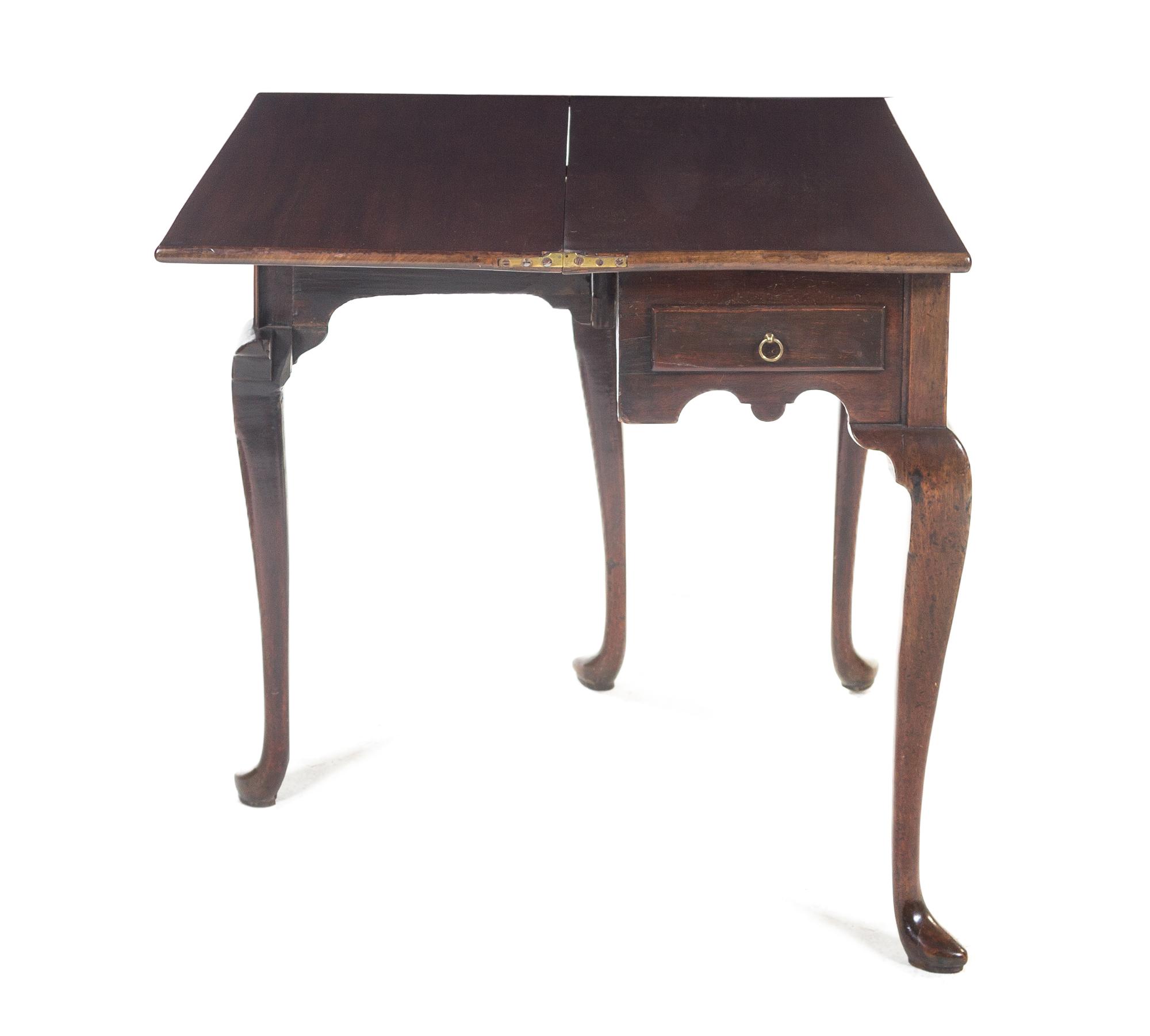An English Walnut Games Table, Height 29 x width 31 x depth 14 inches.
