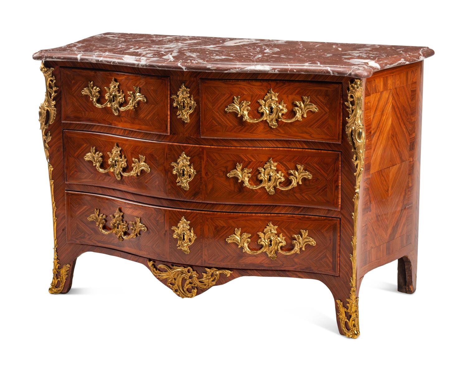A Régence Gilt Bronze Mounted Tulipwood Marble-Top Commode