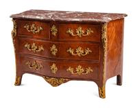 A Régence Gilt Bronze Mounted Tulipwood Marble-Top Commode