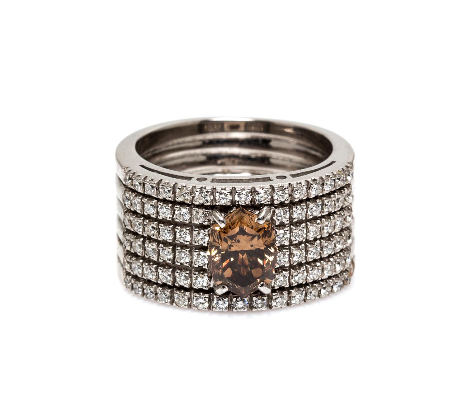 An 18 Karat White Gold, Colored Diamond and Diamond Ring, 8.30 dwts.