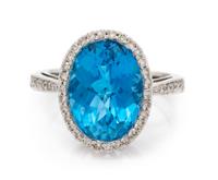 A 14 Karat White Gold, Blue Topaz and Diamond Ring, 3.90 dwts.