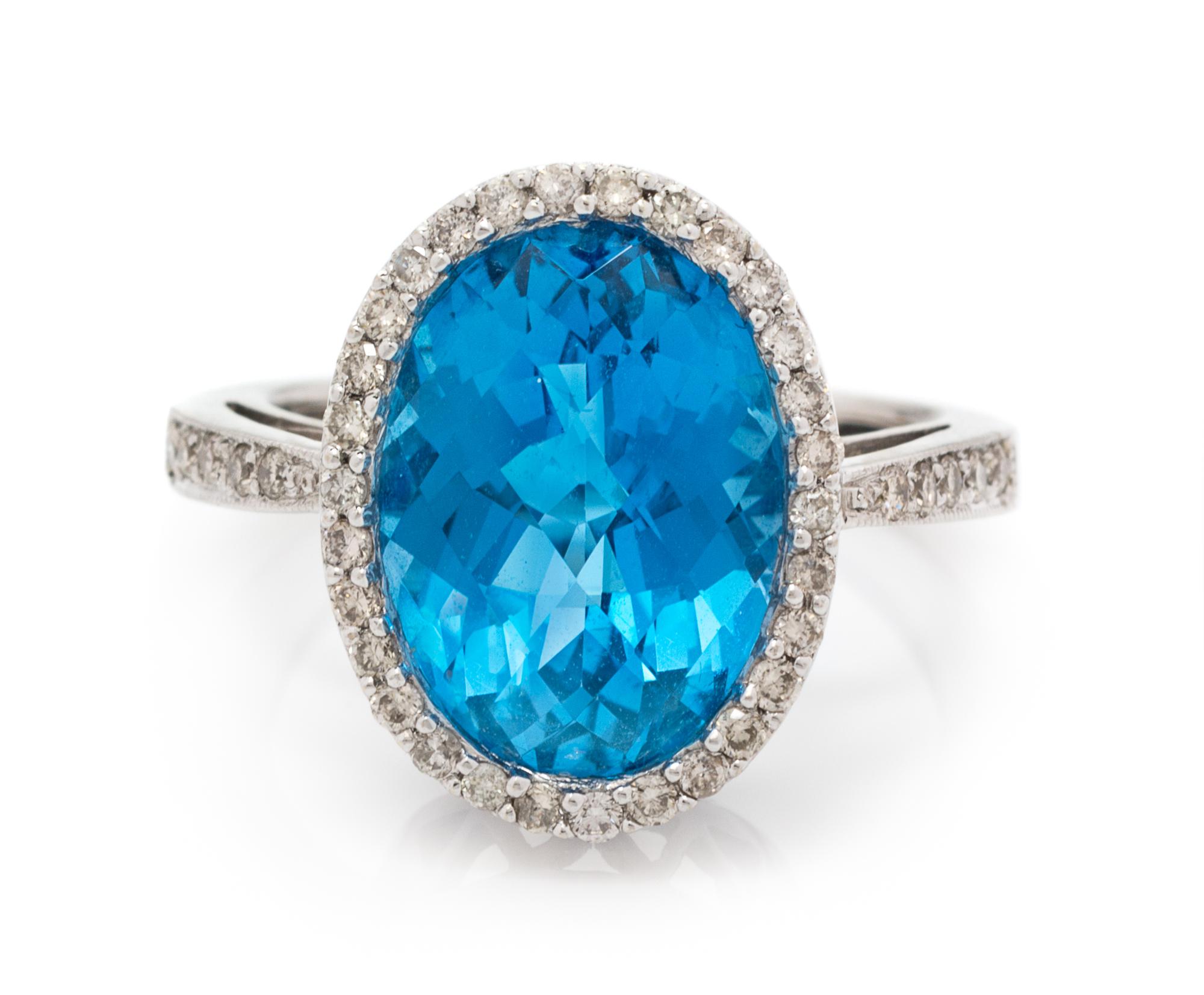 A 14 Karat White Gold, Blue Topaz and Diamond Ring, 3.90 dwts.