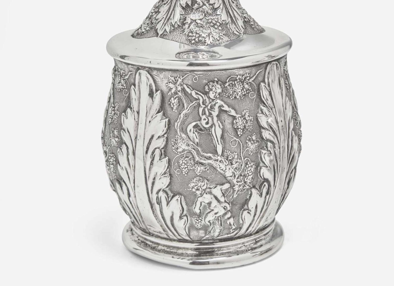 A Continental repoussé silver carafe and a sterling silver teapot, the teapot by Tiffany & Co., New York, NY, 1873-1891
