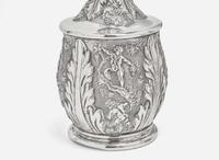A Continental repoussé silver carafe and a sterling silver teapot, the teapot by Tiffany & Co., New York, NY, 1873-1891