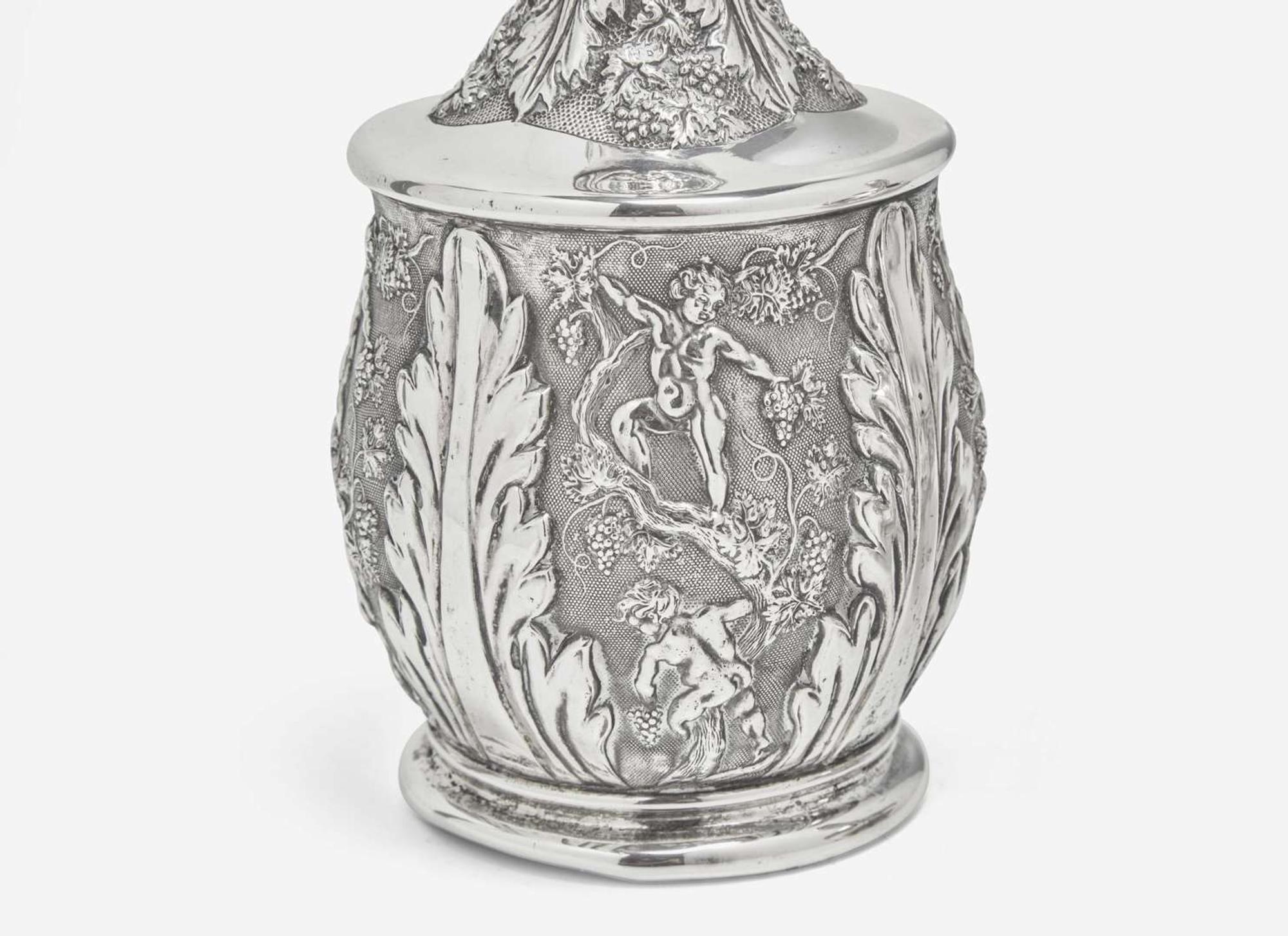 A Continental repoussé silver carafe and a sterling silver teapot, the teapot by Tiffany & Co., New York, NY, 1873-1891