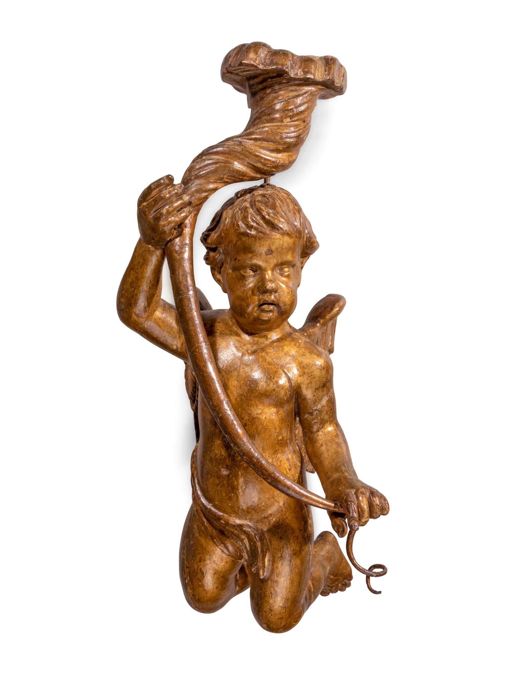 An Italian Carved Giltwood Figure of a Putto
