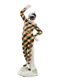 A German Porcelain Harlequin Figure