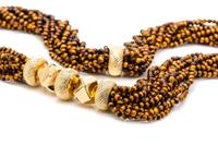 An 18 Karat Yellow Gold and Tiger's Eye Quartz Multi Strand Longchain Necklace, Van Cleef and Arpels,