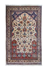 An Isfahan Wool Rug 8 feet x 5 feet.