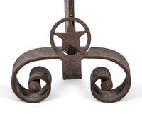 A Pair of Iron Andirons with Star Ornaments