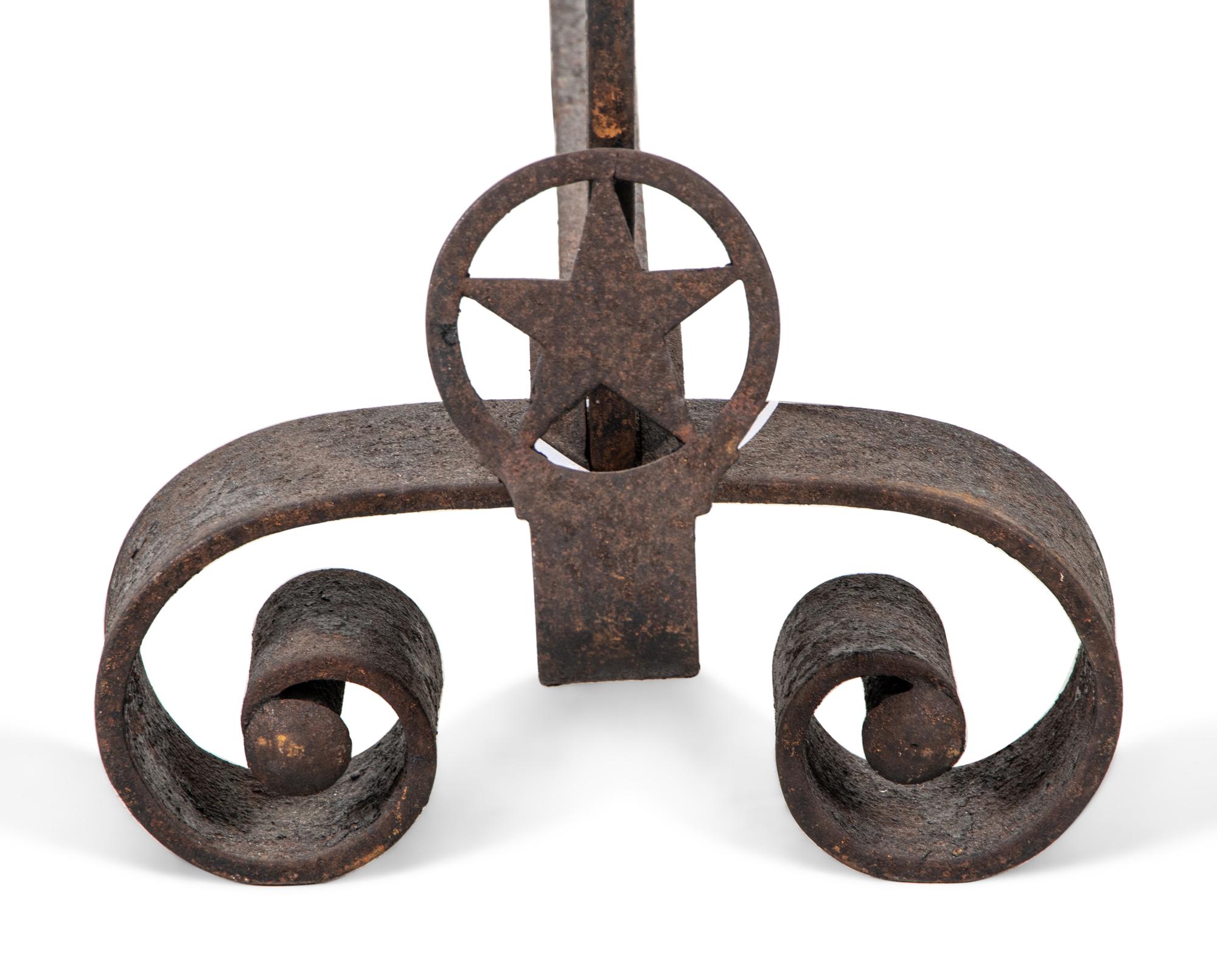 A Pair of Iron Andirons with Star Ornaments