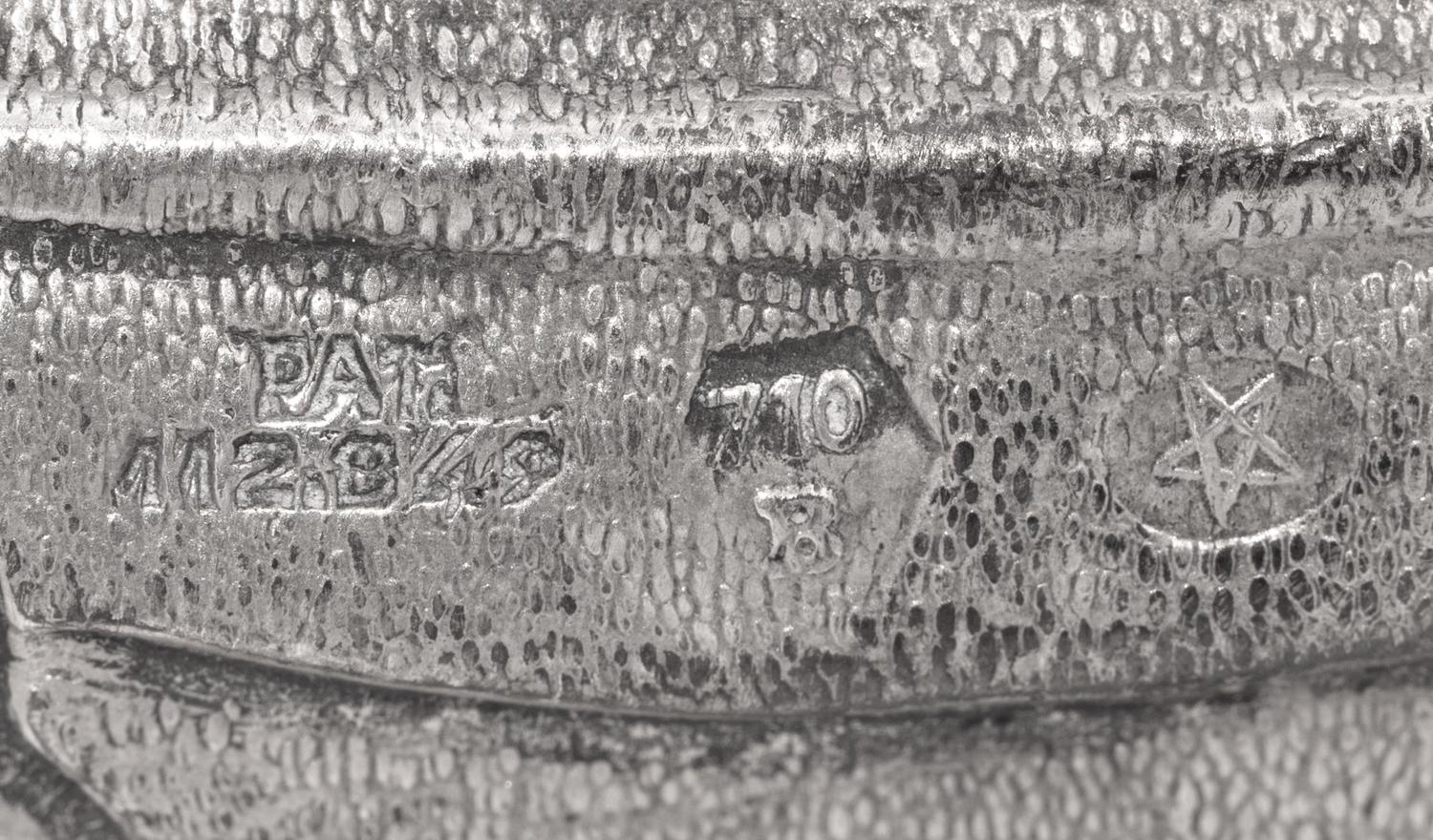 A Silver Model of a Crab and Lionfish