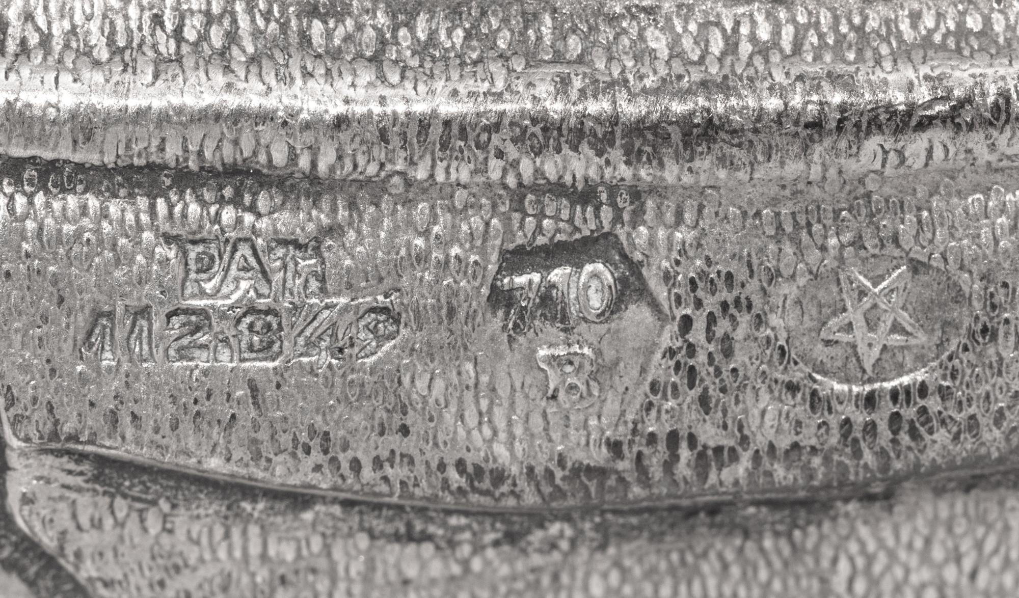 A Silver Model of a Crab and Lionfish