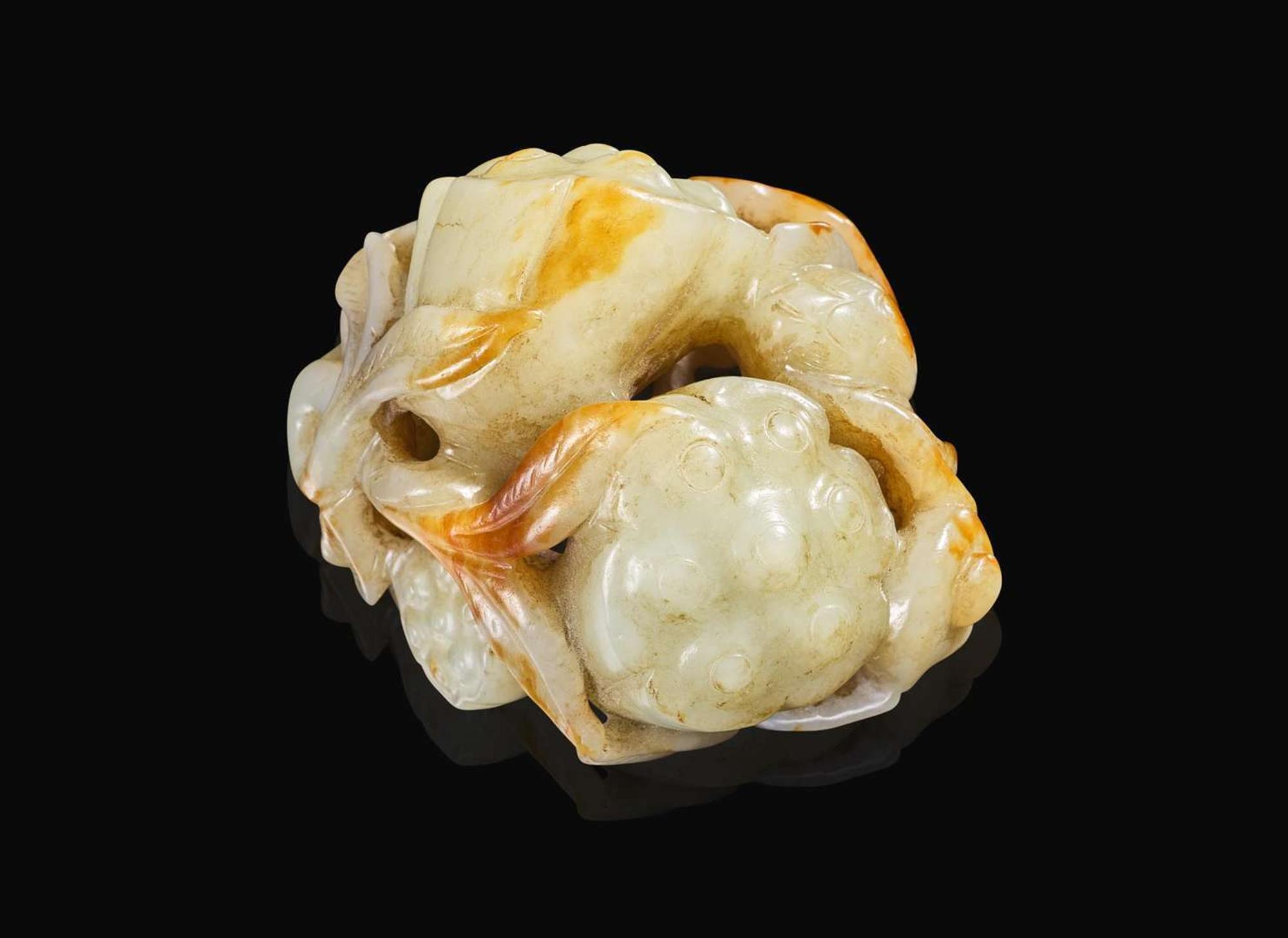 A Chinese carved pale celadon and russet jade "Lotus" group, Qing dynasty 青白玉荷蓮玉雕 清