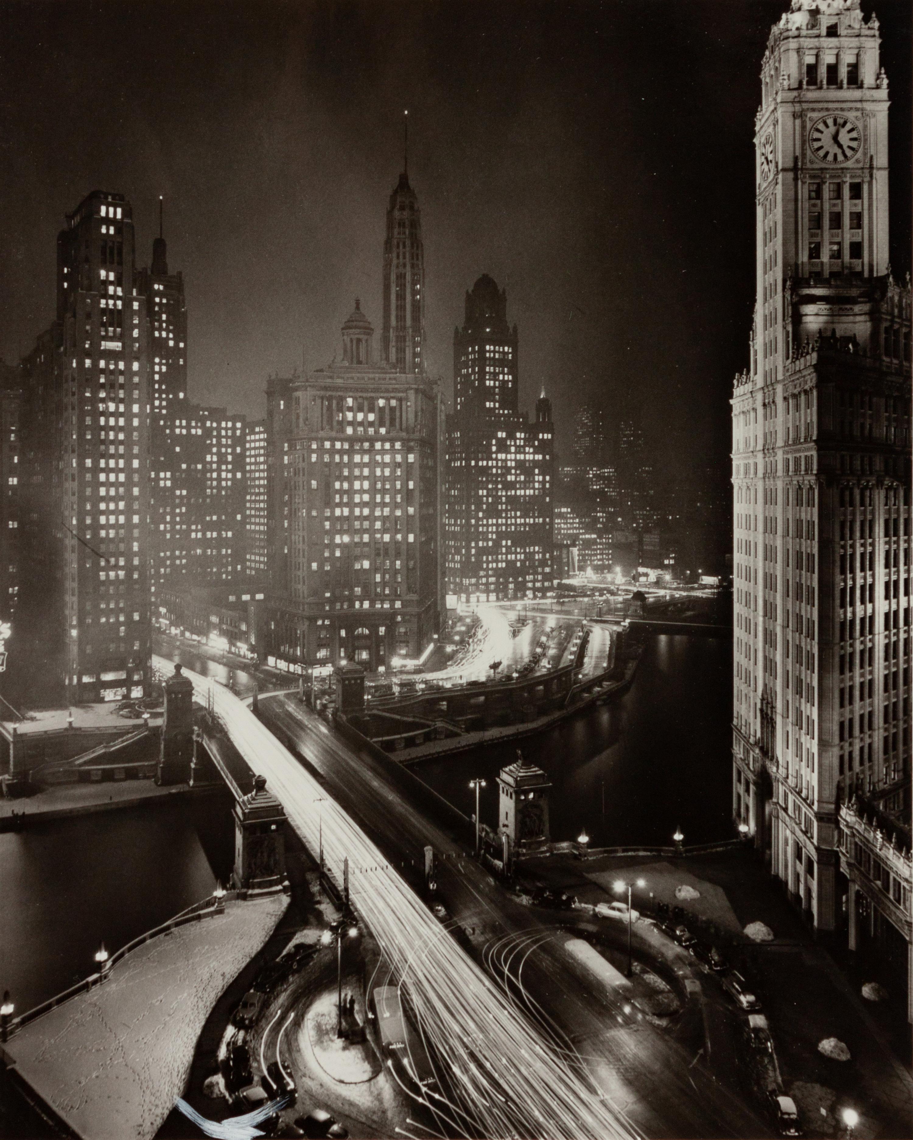 A group of four photographs depicting Chicago ( Rush Street, Chicago's Night Club District , c. 1950; Wrigley Building at Night, Michigan Ave. Bridge , c. 1950; Chicago , c. 1935; State Street and Marshall Field Clock , c. 1950)