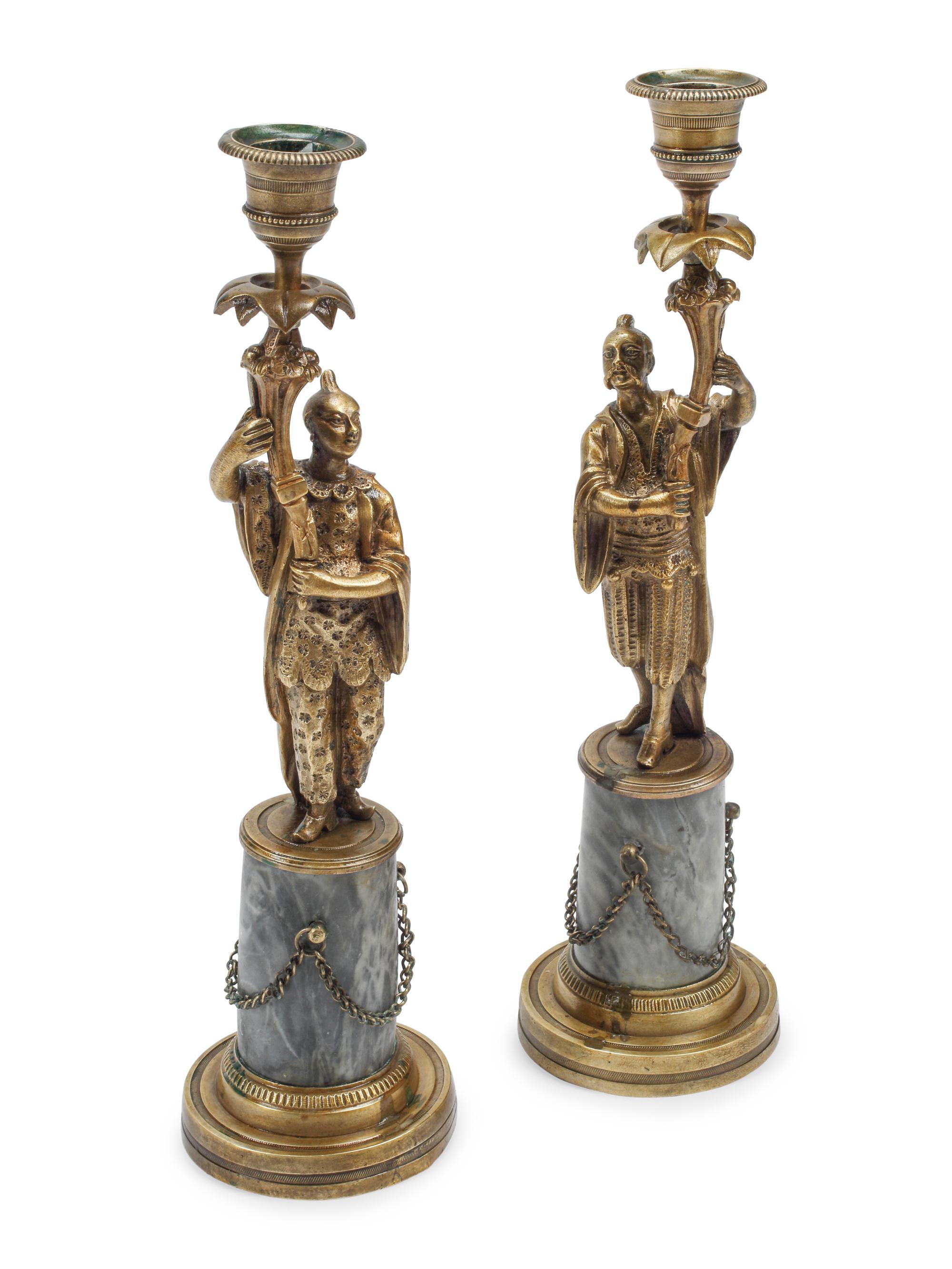A Pair of French Bronze Figural Candlesticks on Marble Bases