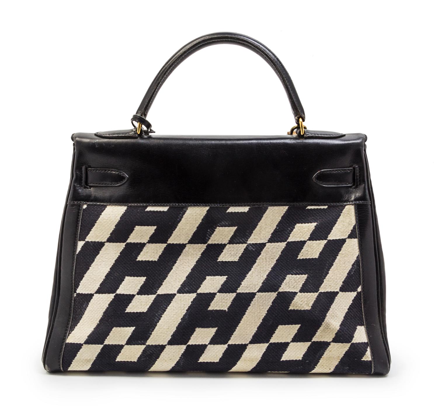 A Rare Hermes 35cm Ulysses Black Leather and Ivory Canvas Kelly Bag, 13 x 9 x 5 inches.
