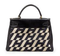 A Rare Hermes 35cm Ulysses Black Leather and Ivory Canvas Kelly Bag, 13 x 9 x 5 inches.