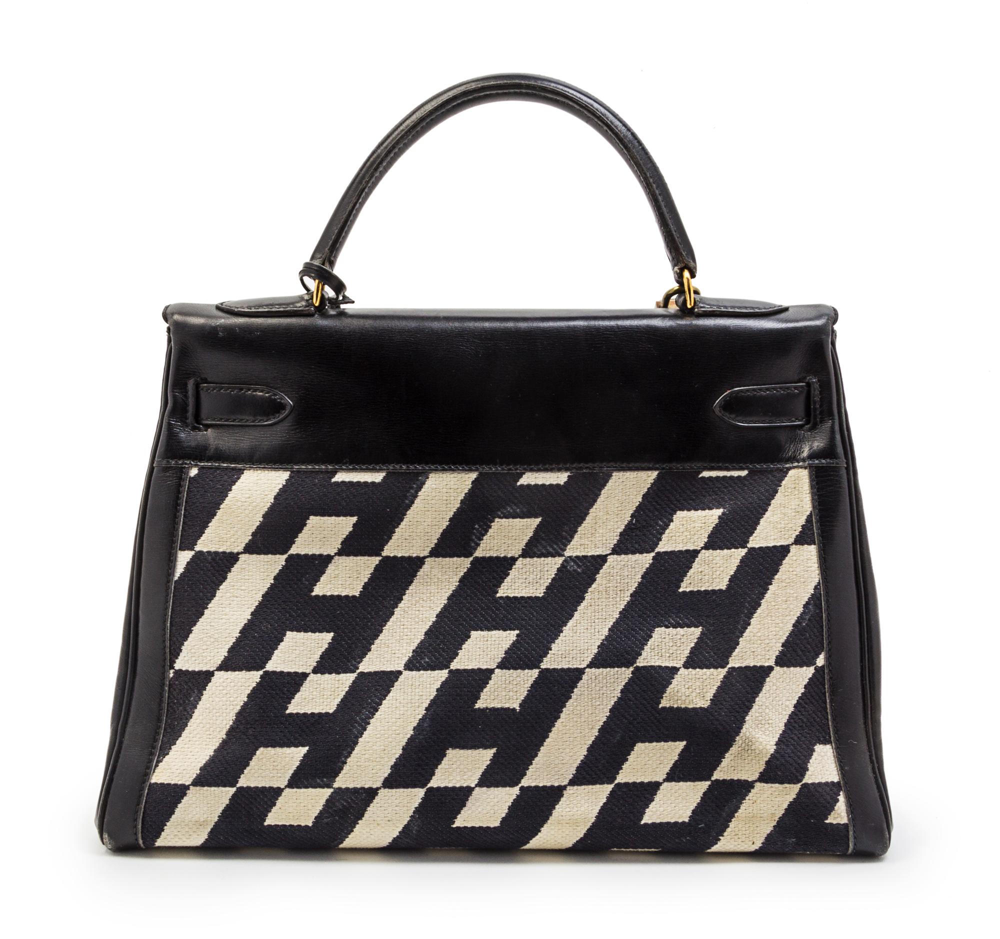 A Rare Hermes 35cm Ulysses Black Leather and Ivory Canvas Kelly Bag, 13 x 9 x 5 inches.
