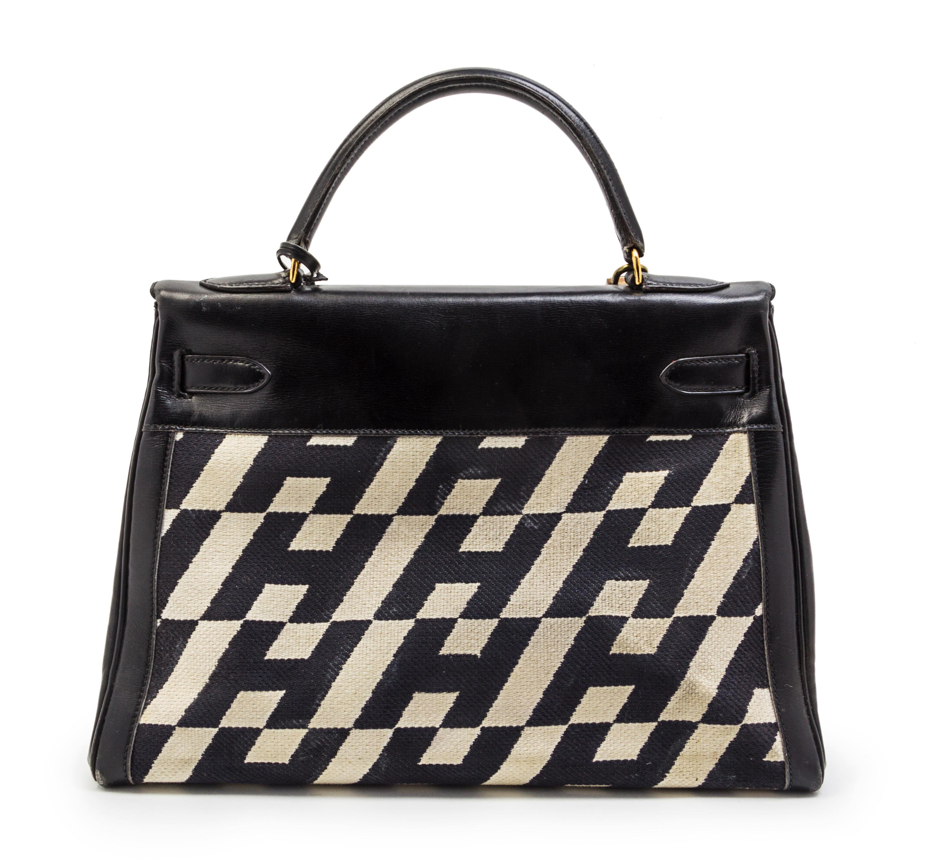 A Rare Hermes 35cm Ulysses Black Leather and Ivory Canvas Kelly Bag, 13 x 9 x 5 inches.