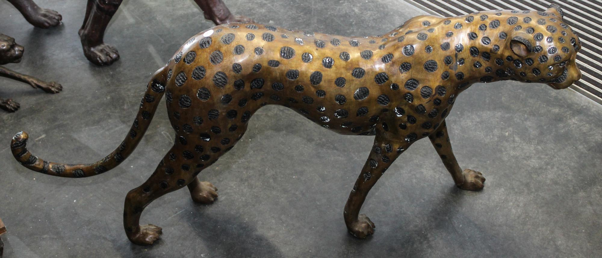 A Brass Cheetah. Height 24 x length 51 1/2 inches.