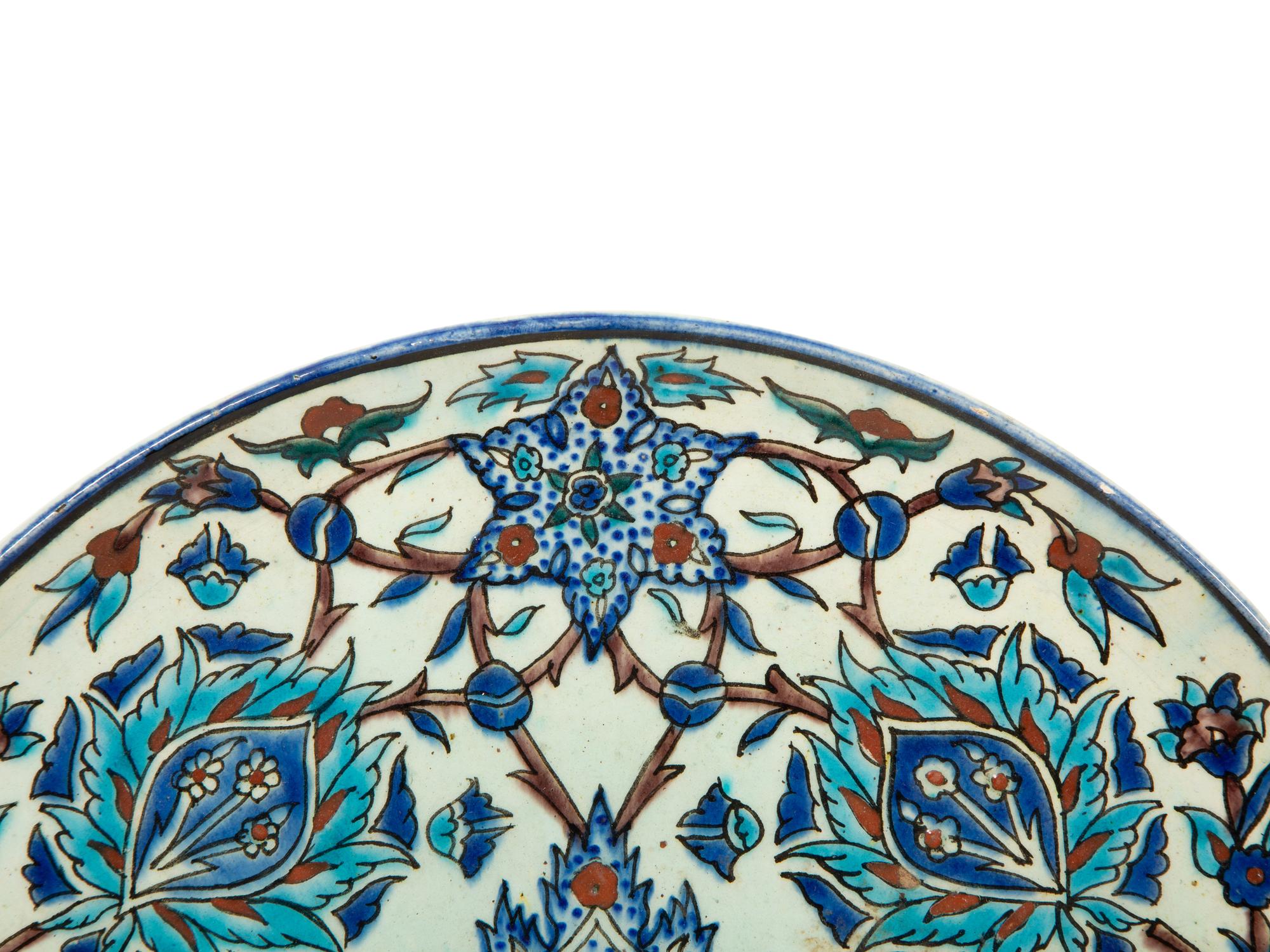 An Islamic Iznik Glazed Pottery Plate and a Small Vase