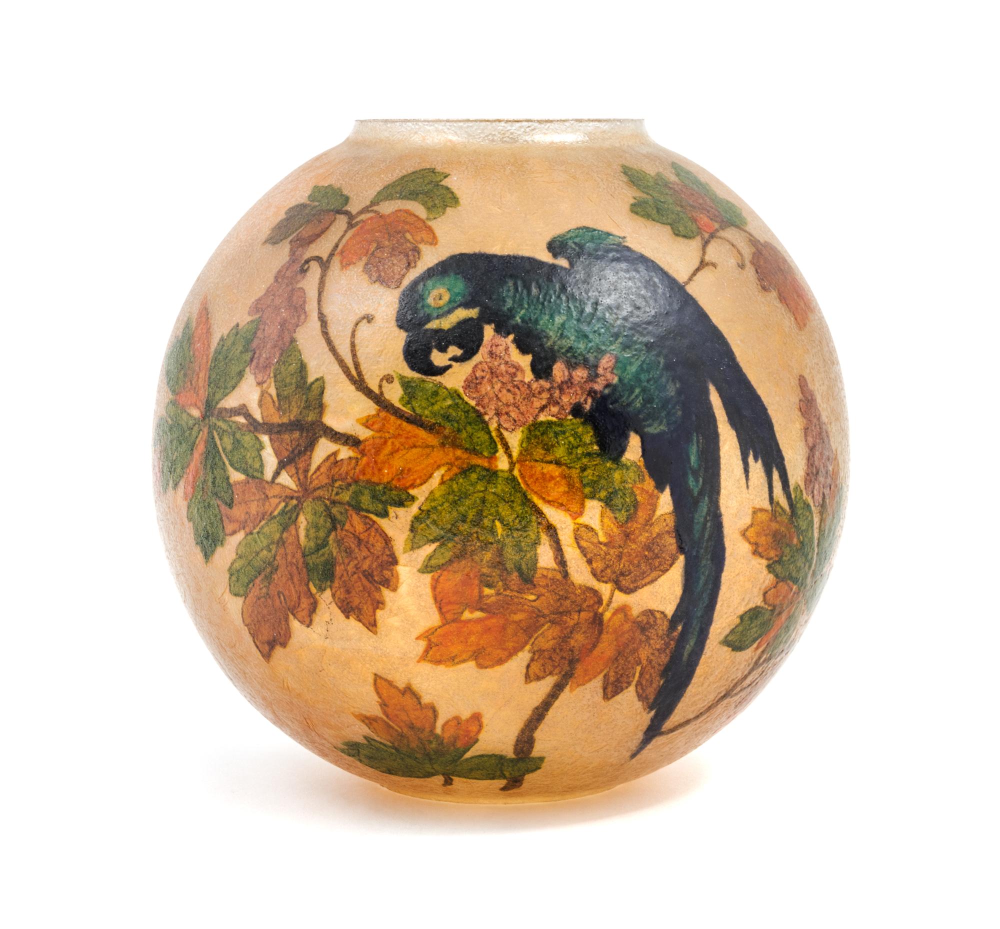 Handel, EARLY 20TH CENTURY, a reverse painted globe, of spherical form decorated with parrots
