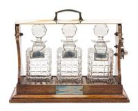 A Victorian Silver-Plate Mounted Oak Tantalus Height 9 3/4 x width 15 1/8 inches. — 19TH CENTURY
