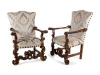 A Pair of Italian Baroque Style Parcel Gilt Walnut Armchairs