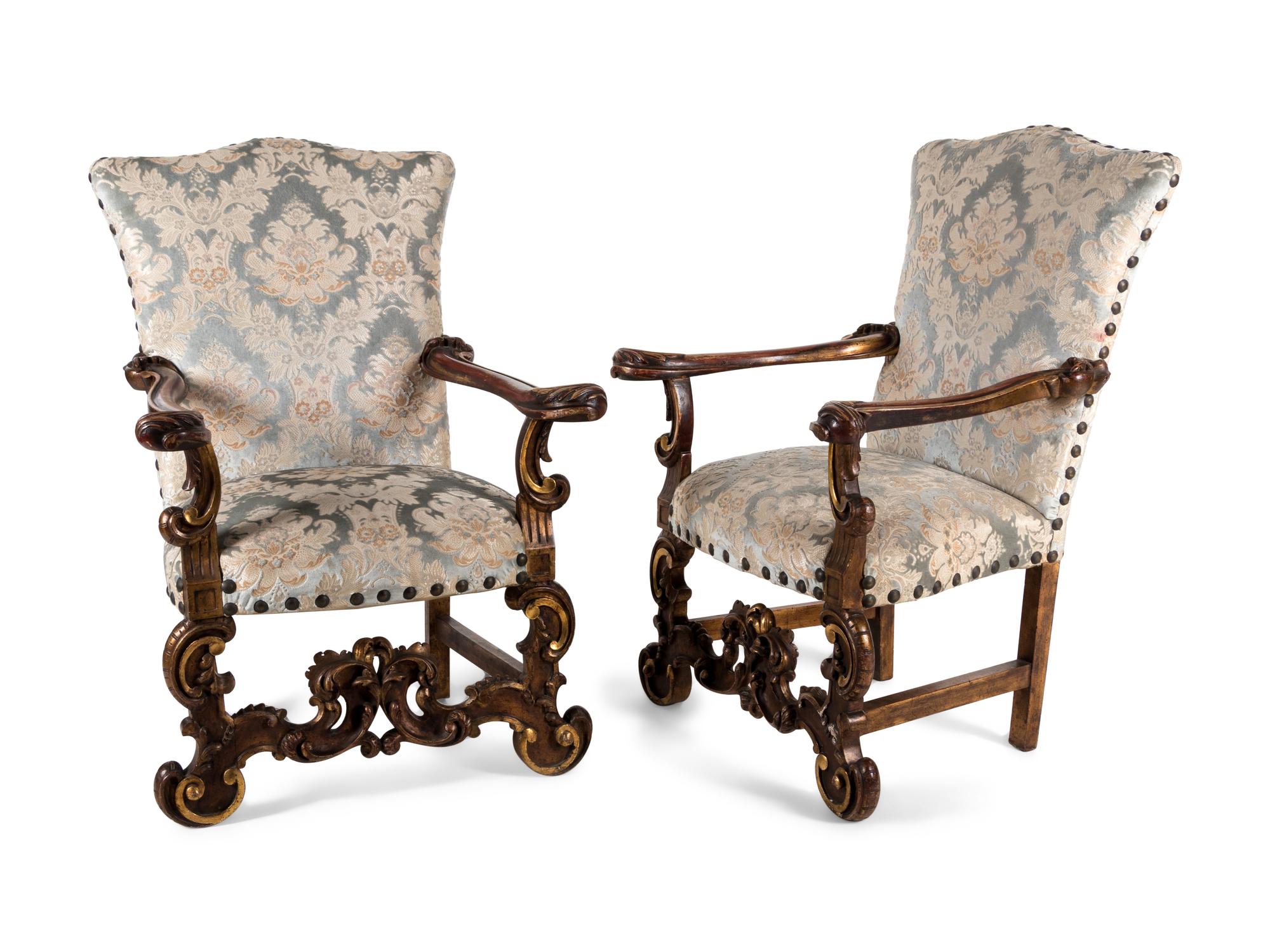 A Pair of Italian Baroque Style Parcel Gilt Walnut Armchairs