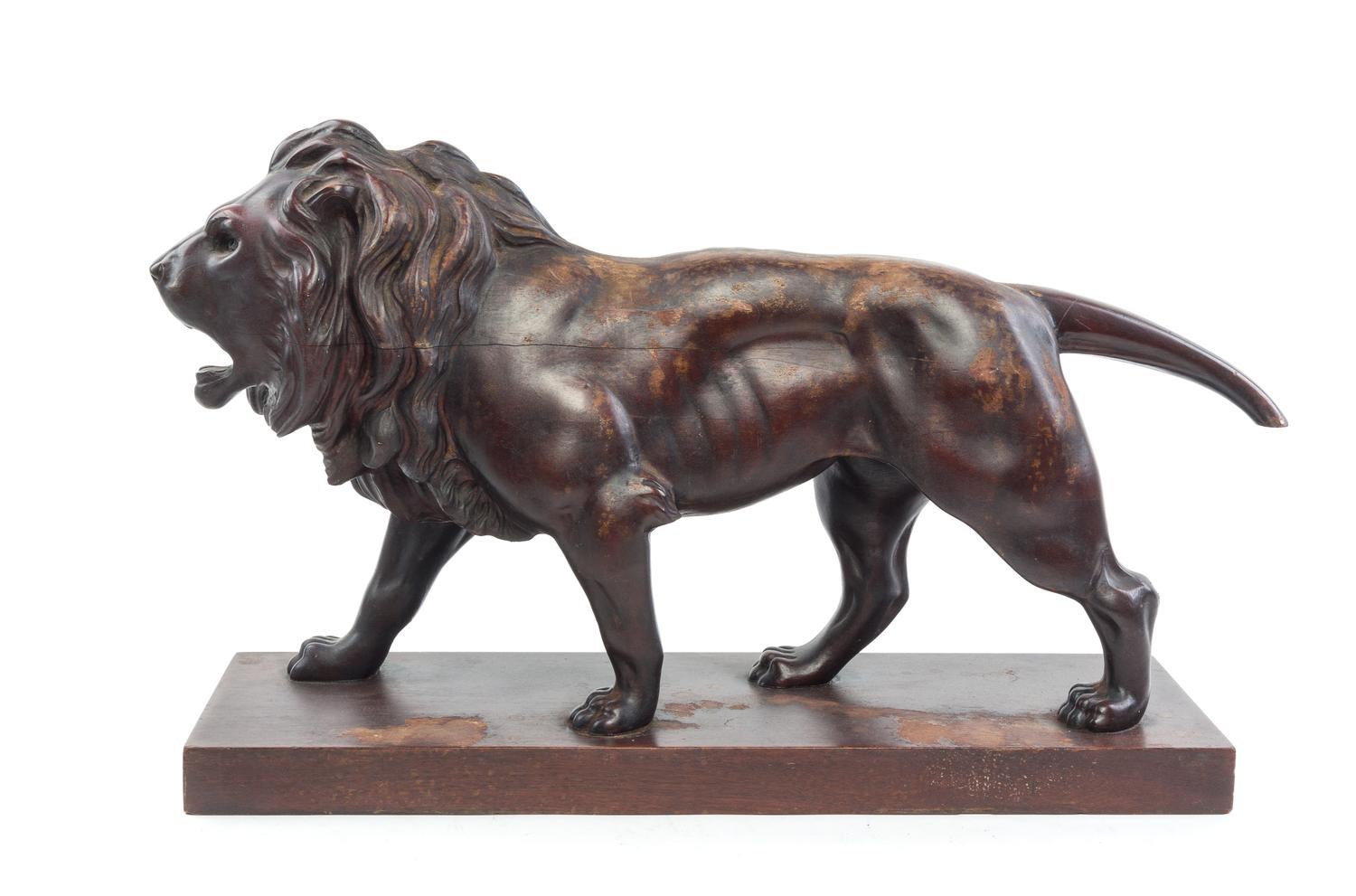 A Continental Carved Mahogany Figure Length 29 inches. — 19TH CENTURY