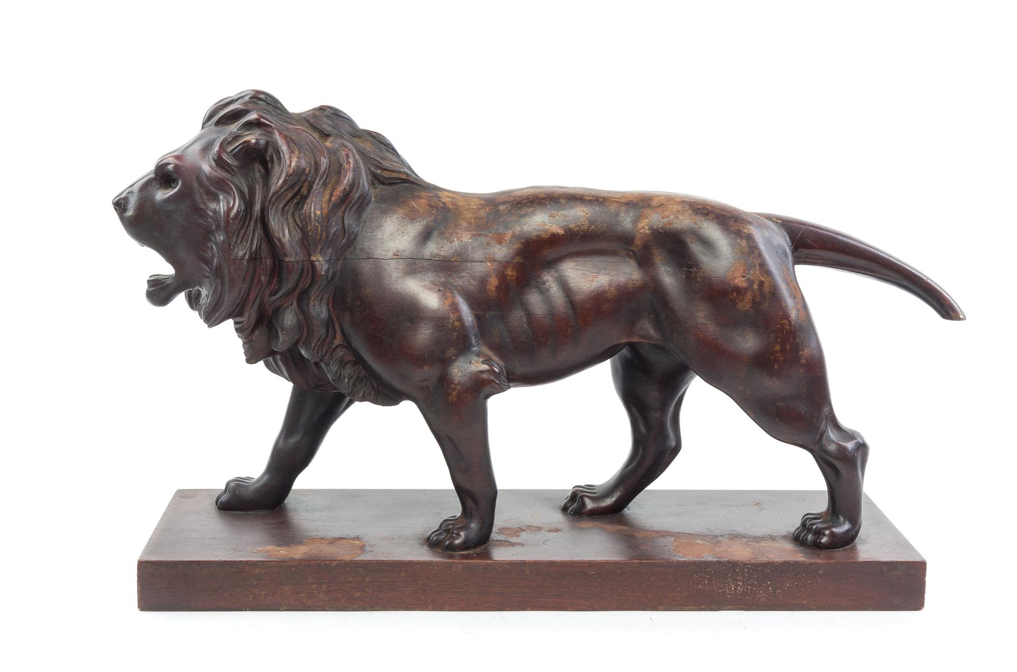 A Continental Carved Mahogany Figure Length 29 inches. — 19TH CENTURY