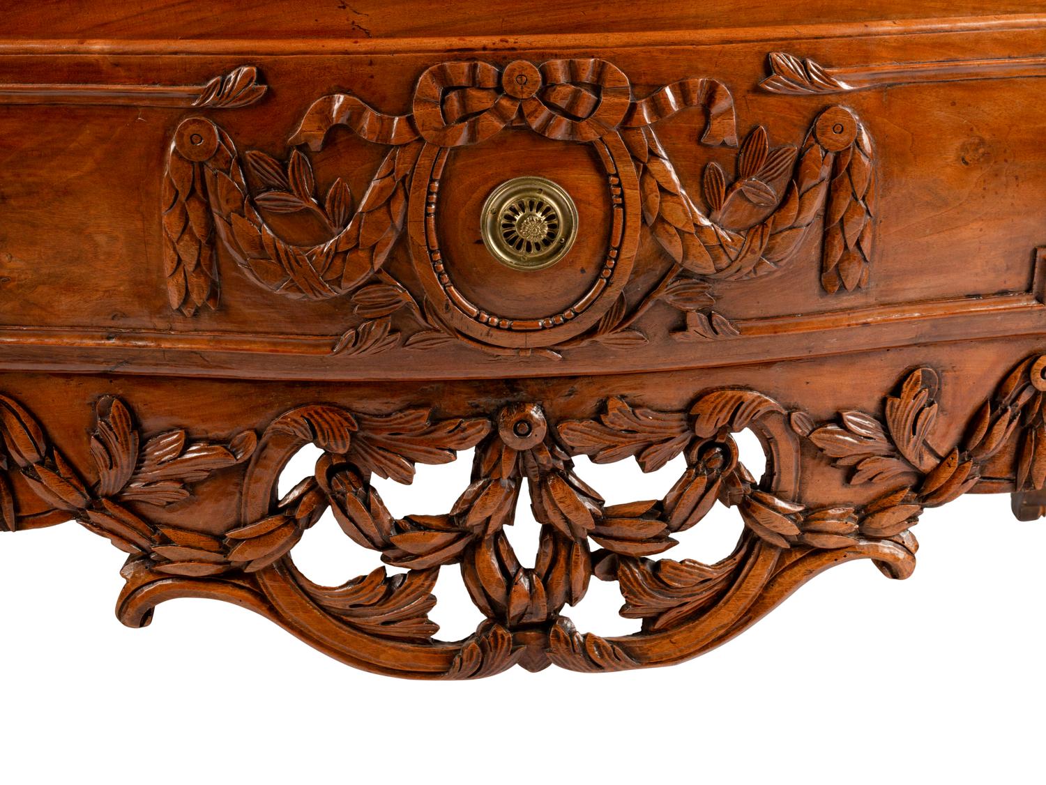 A Louis XV Provincial Carved Walnut Commode — LATE 18TH CENTURY