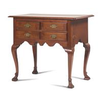 A Queen Anne Carved Walnut Spanish-Foot Dressing Table