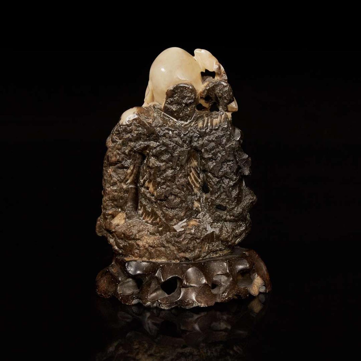 A Chinese carved beige and dark brown soapstone figure of Shoulao 棕灰壽山石雕壽老 19th/20th century ???????