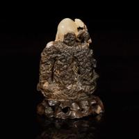 A Chinese carved beige and dark brown soapstone figure of Shoulao 棕灰壽山石雕壽老 19th/20th century ???????