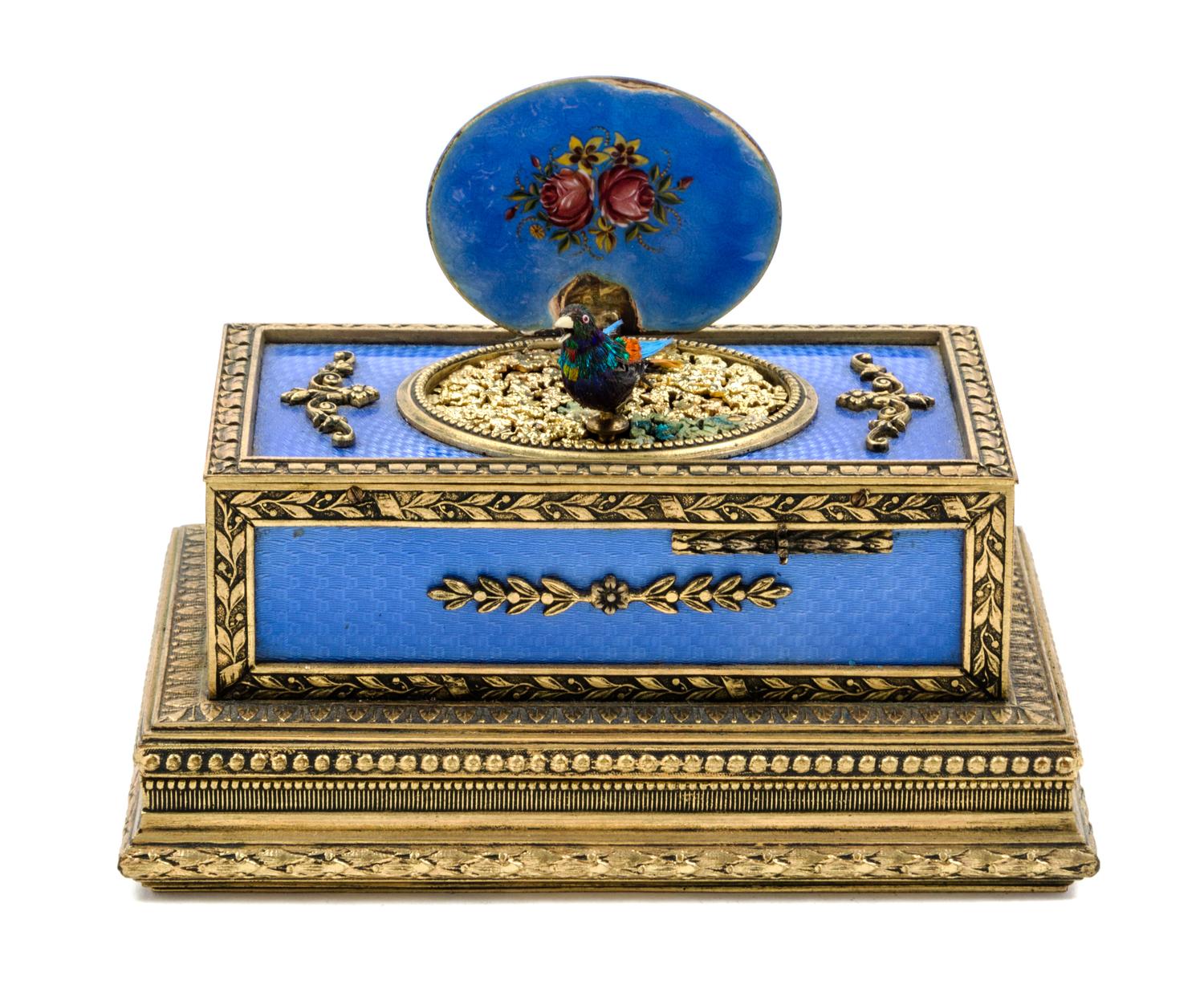 A Swiss Gilt Bronze and Guilloche Enamel Singing Bird Automaton Box Width 4 1/2 inches.