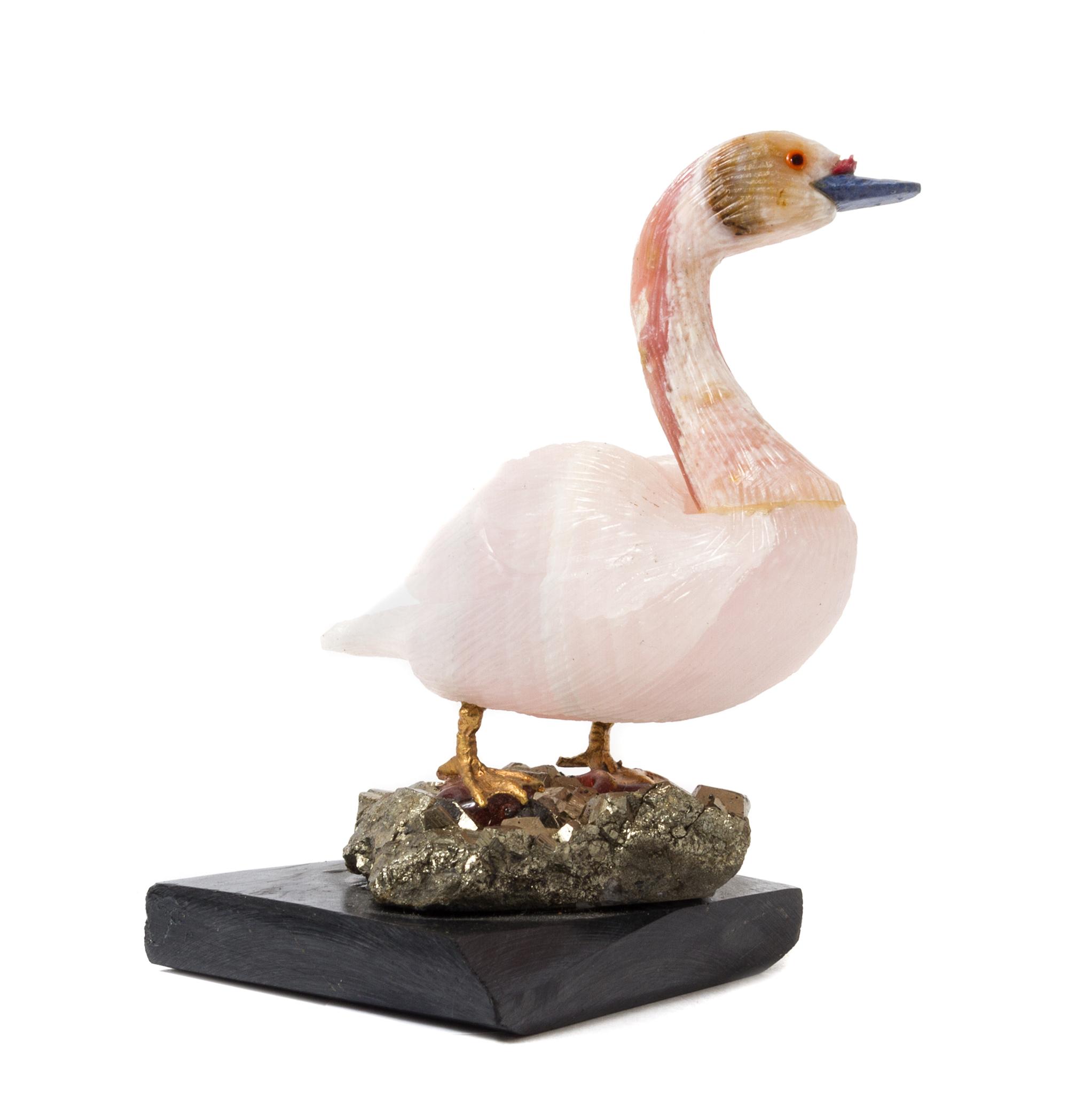A Carved Rose Quartz Model of a Swan Height overall 3 5/8 inches.