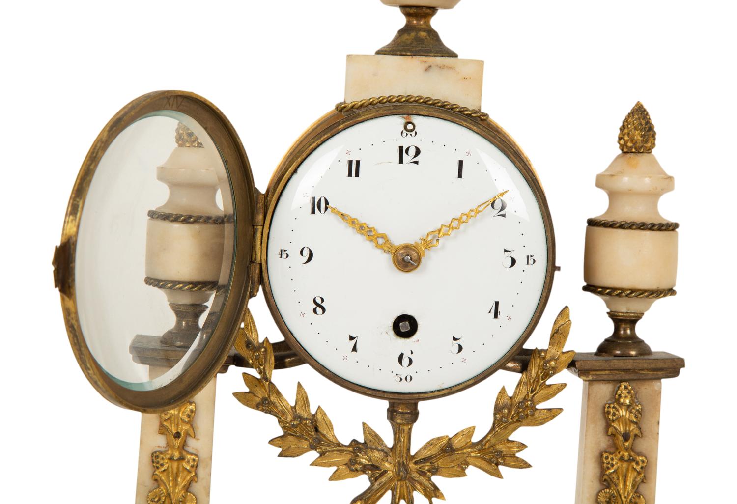A Neoclassical White Marble and Gilt Bronze Portico Clock