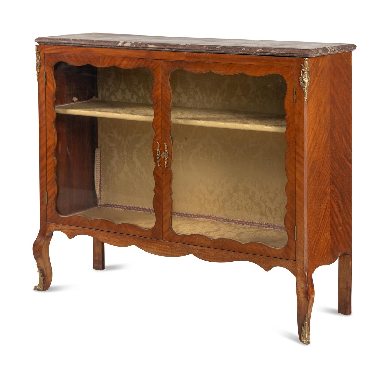 A Louis XV Style Gilt Bronze Mounted Bookmatched Mahogany Marble-Top Bookcase