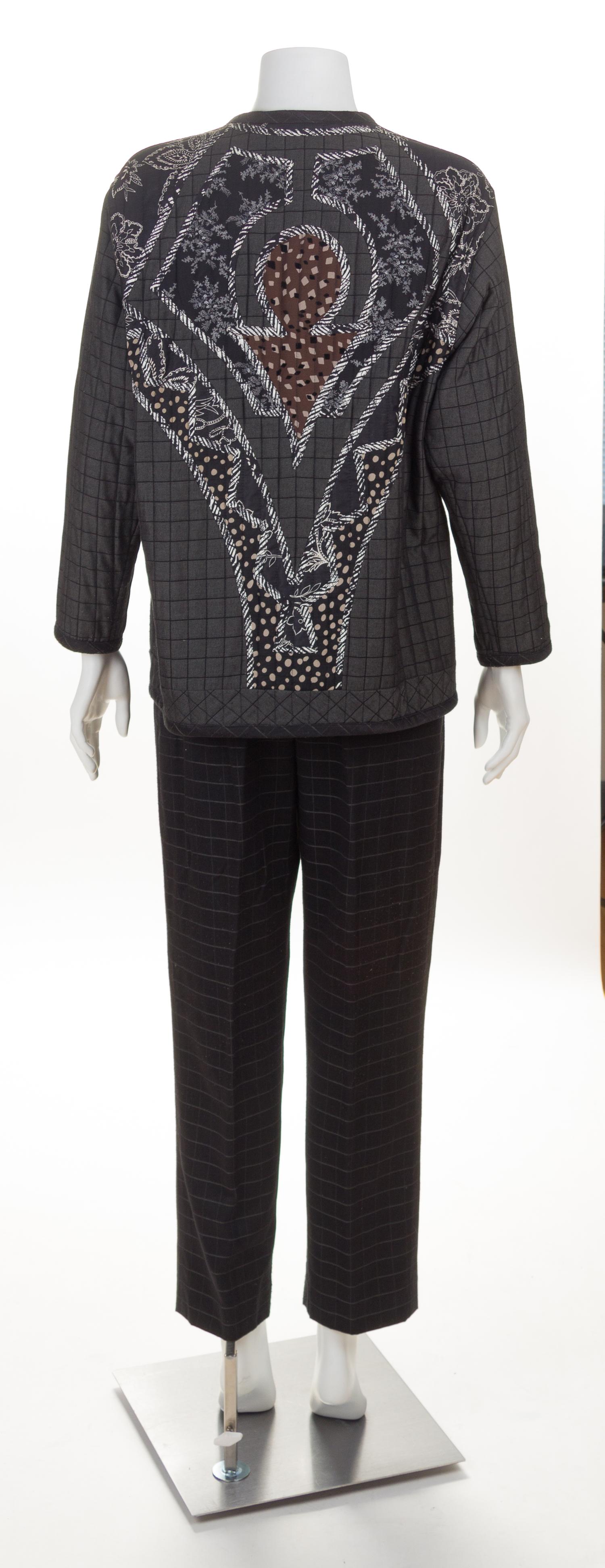A Koos Black Quilted Reversible Jacket and Pant Suit, Jacket size small.