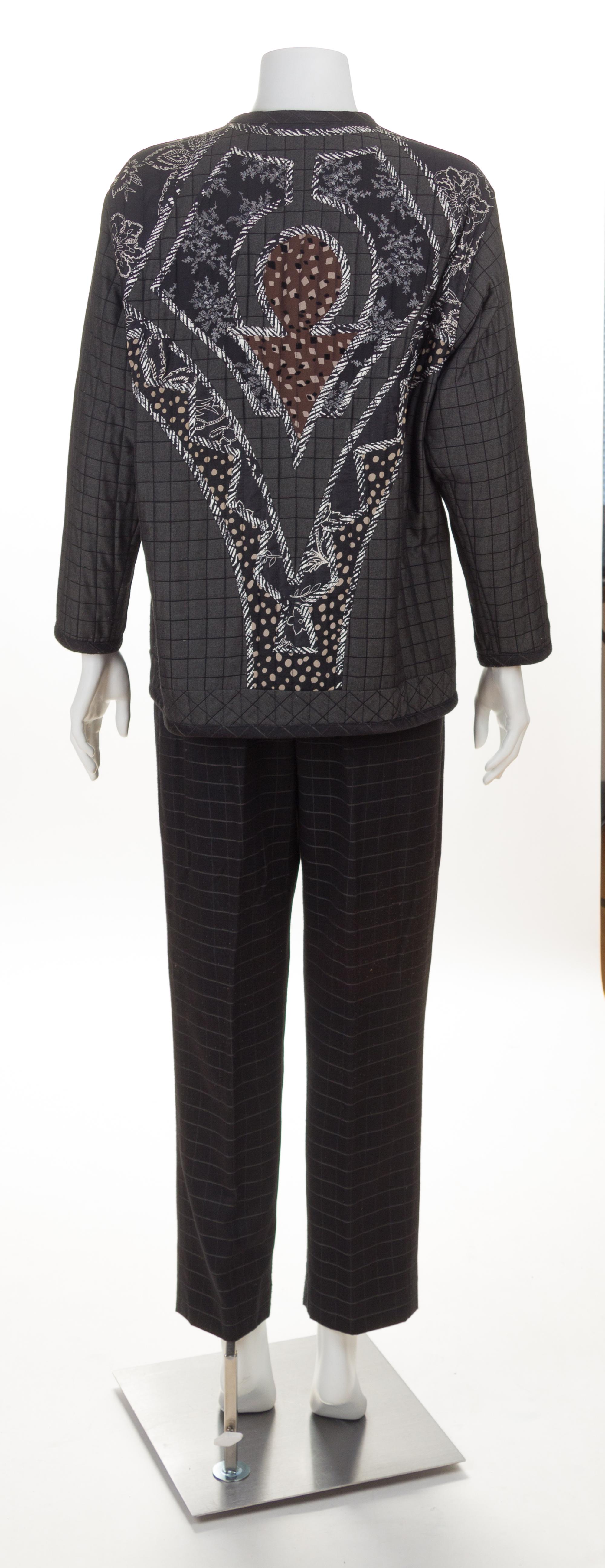 A Koos Black Quilted Reversible Jacket and Pant Suit, Jacket size small.
