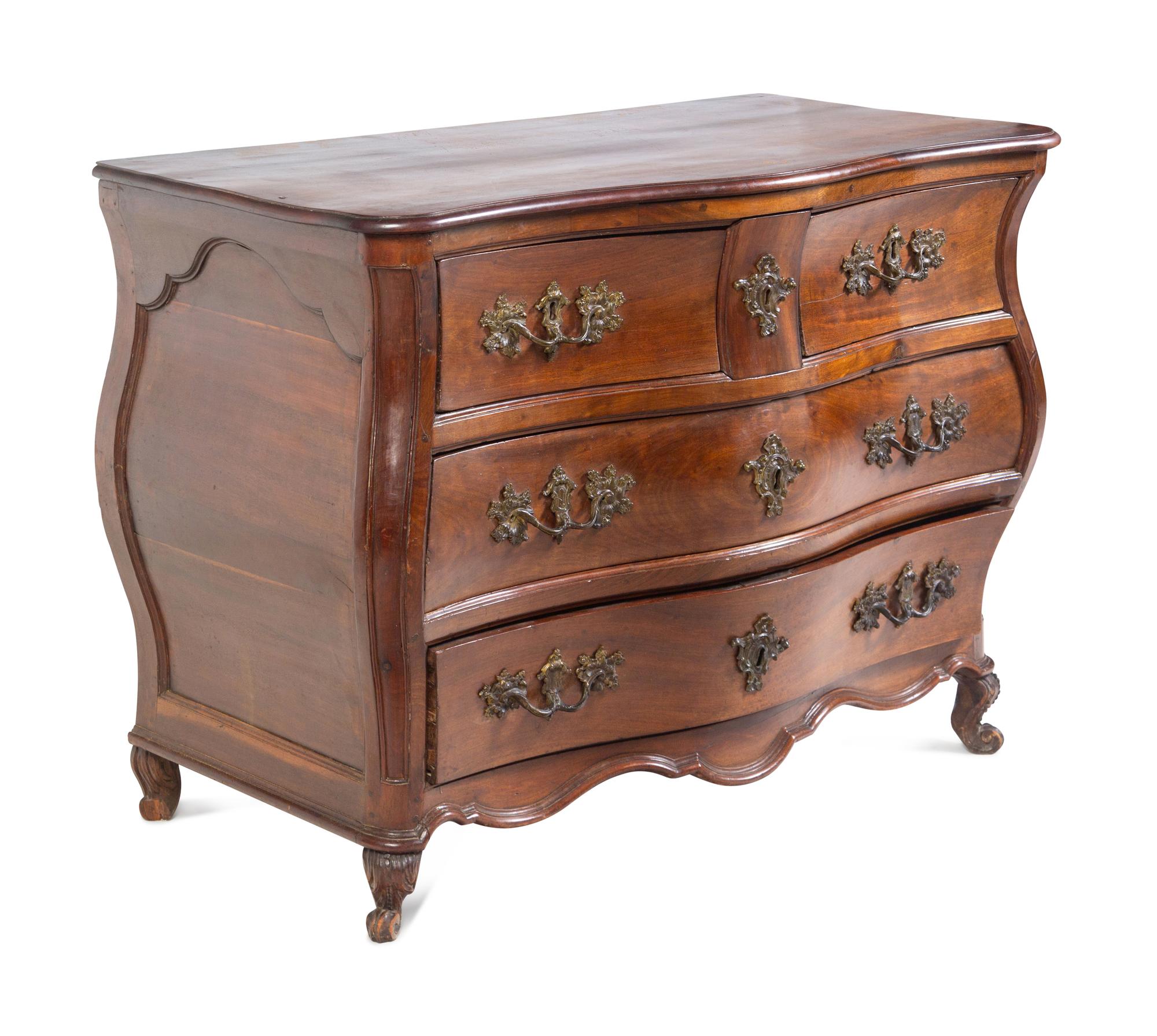 A Louis XV Provincial Walnut Bombé Commode