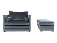 A Contemporary Velvet-Upholstered Armchair and Ottoman