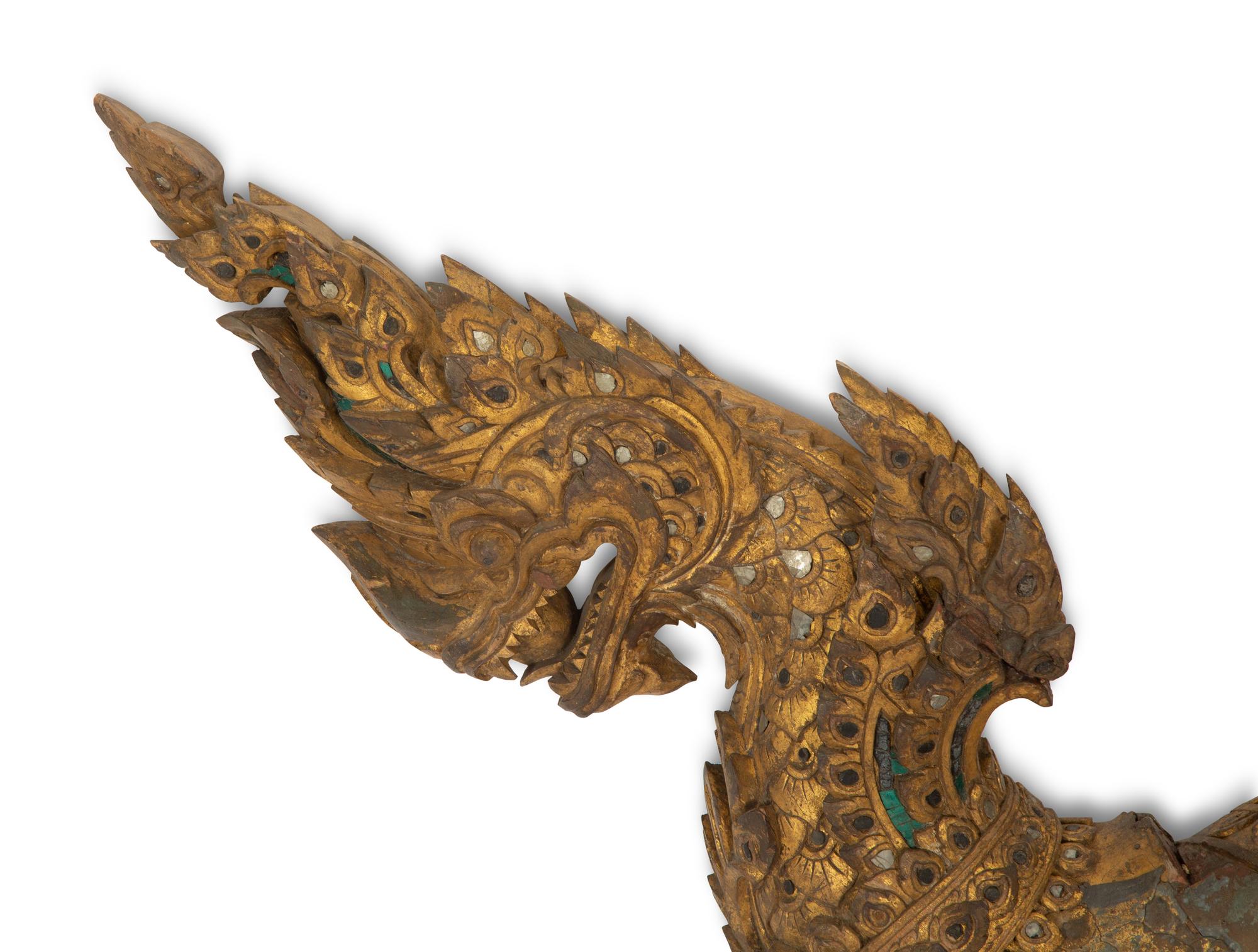 A Large Thai Giltwood and Mirror-Inset Dragon Ornament
