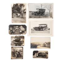 [EARLY PHOTOGRAPHY] --[AUTOMOBILES]. A group of photographs of early automobiles, mechanics and auto shops, including racing action shots, comprising: