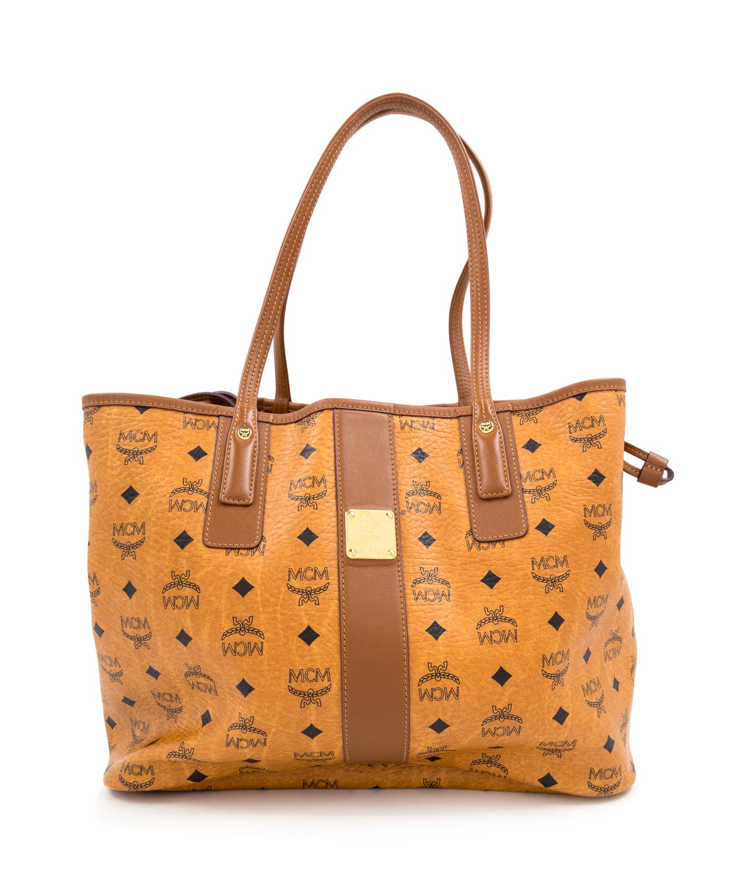 An MCM Cognac Reversible Liz Visetos Shopper Tote, 12" H x 13" W x 6" D; Strap drop: 8.75".