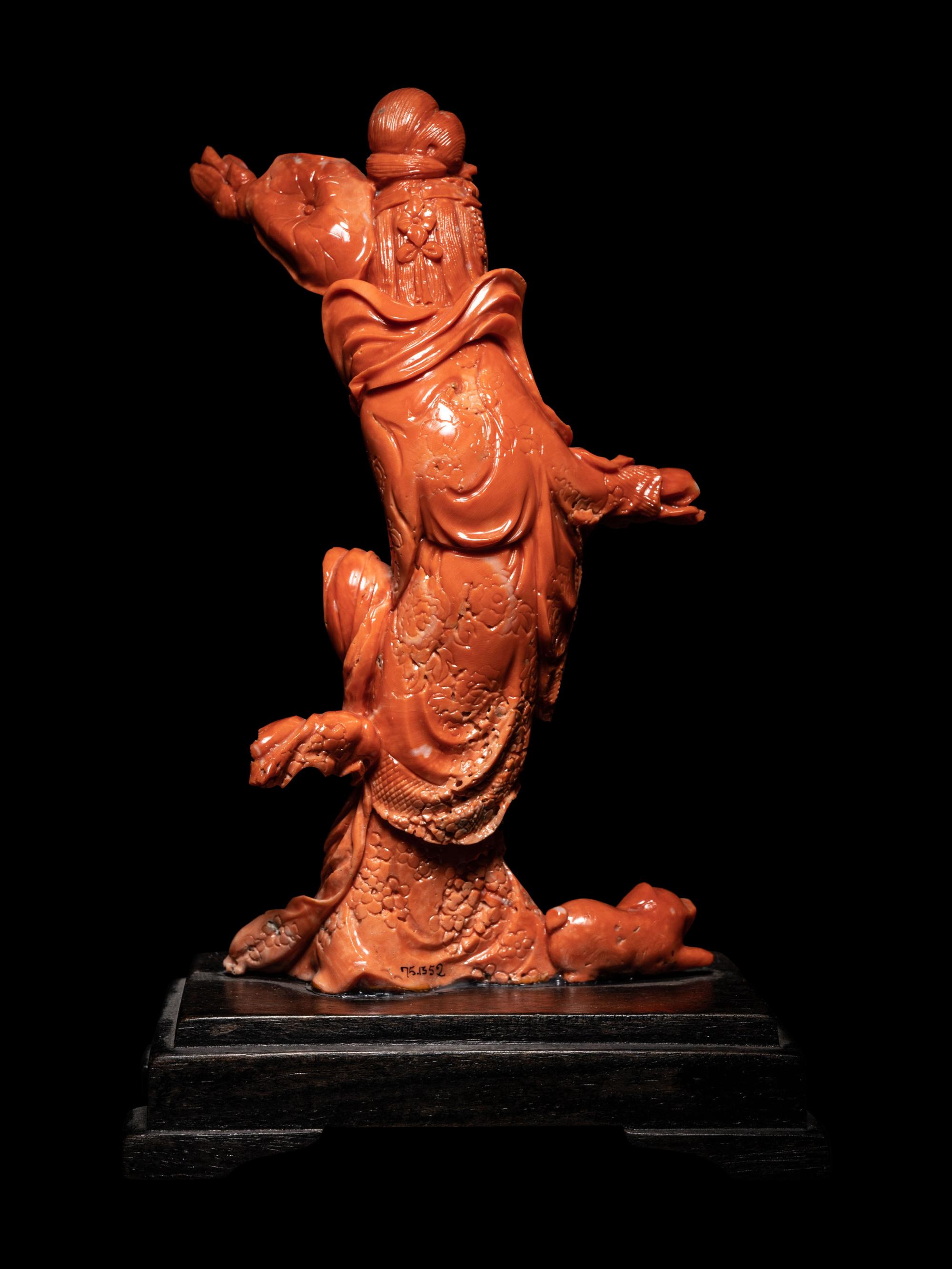 A Chinese Carved Red Coral Figure of a Female Immortal